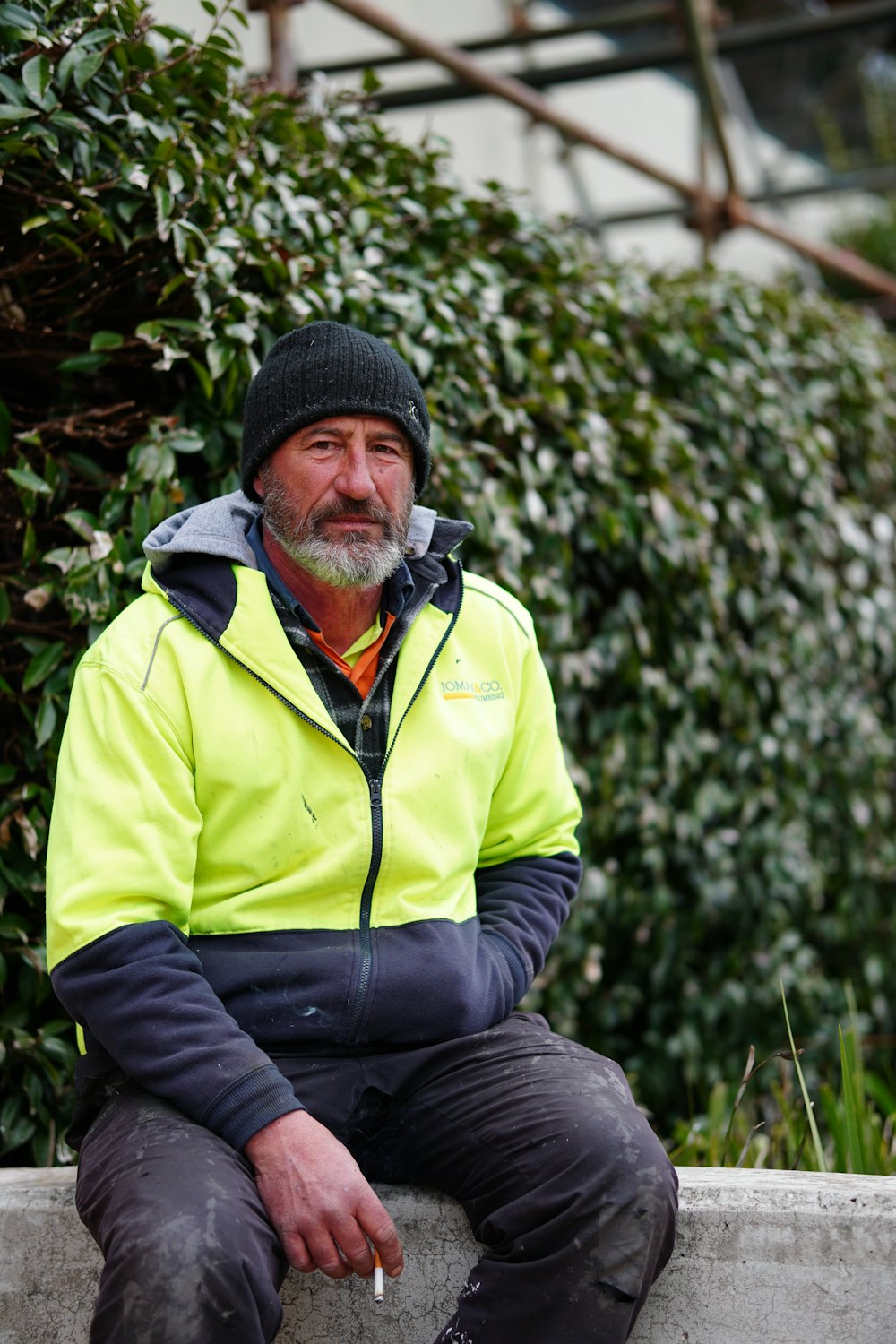 A veteran site worker in a hi-vis jacket