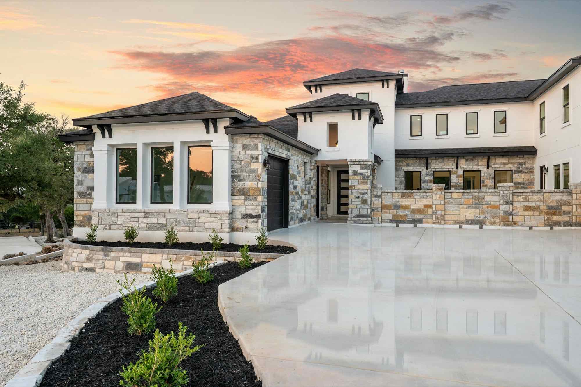 A finished custom home with stone accents