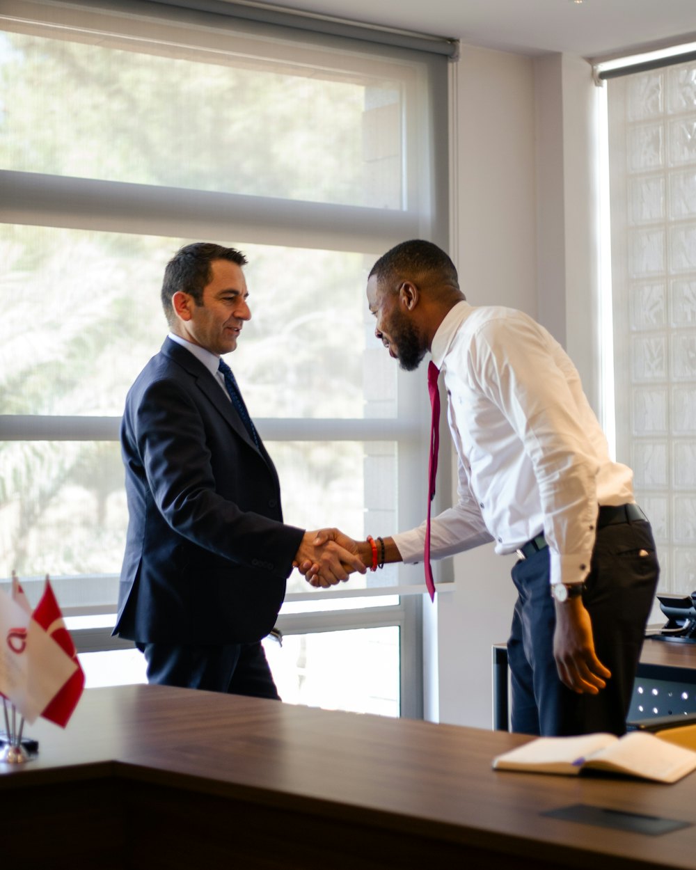 Two bankers shaking hands
